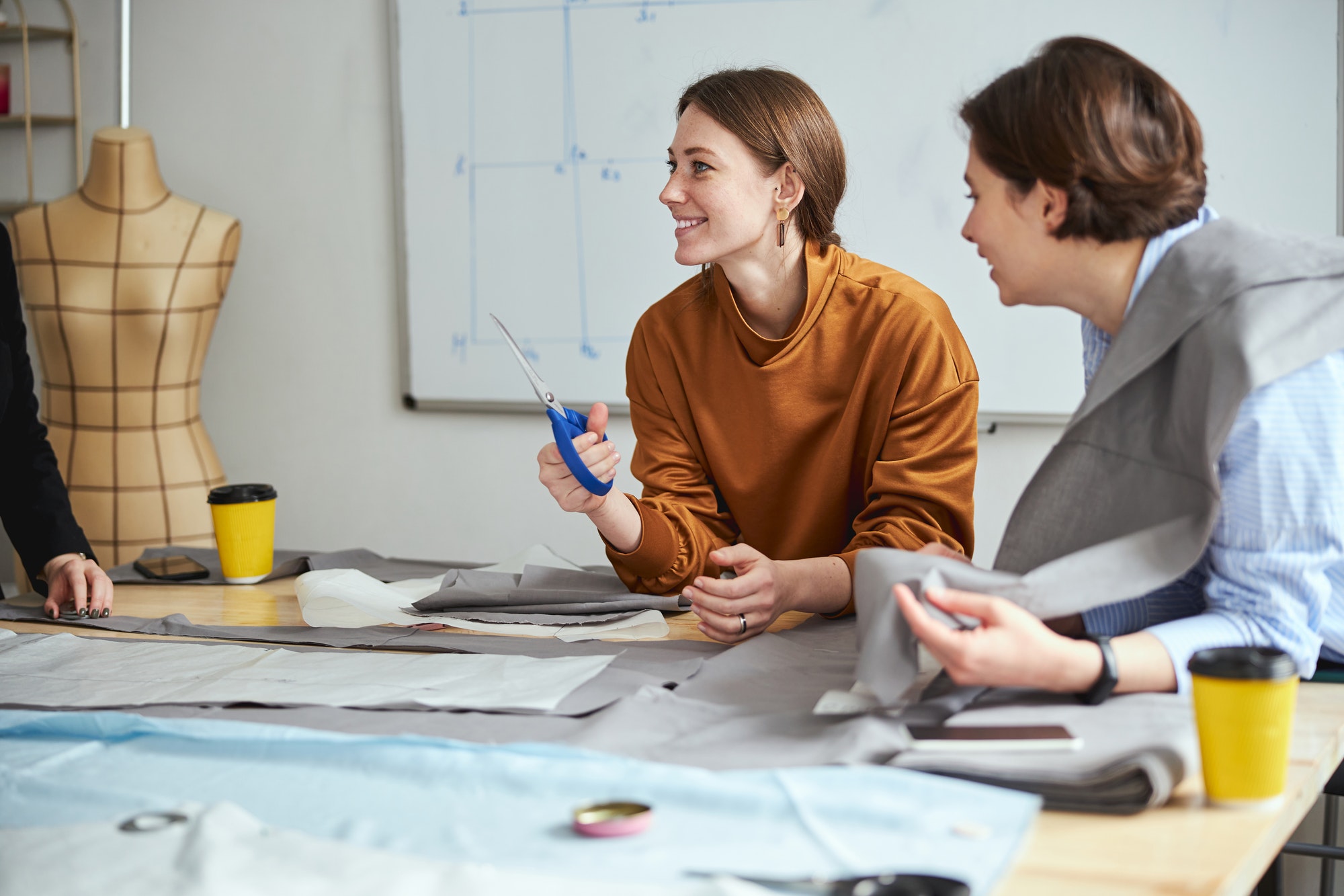 Excited female with scissors smiling to design teacher